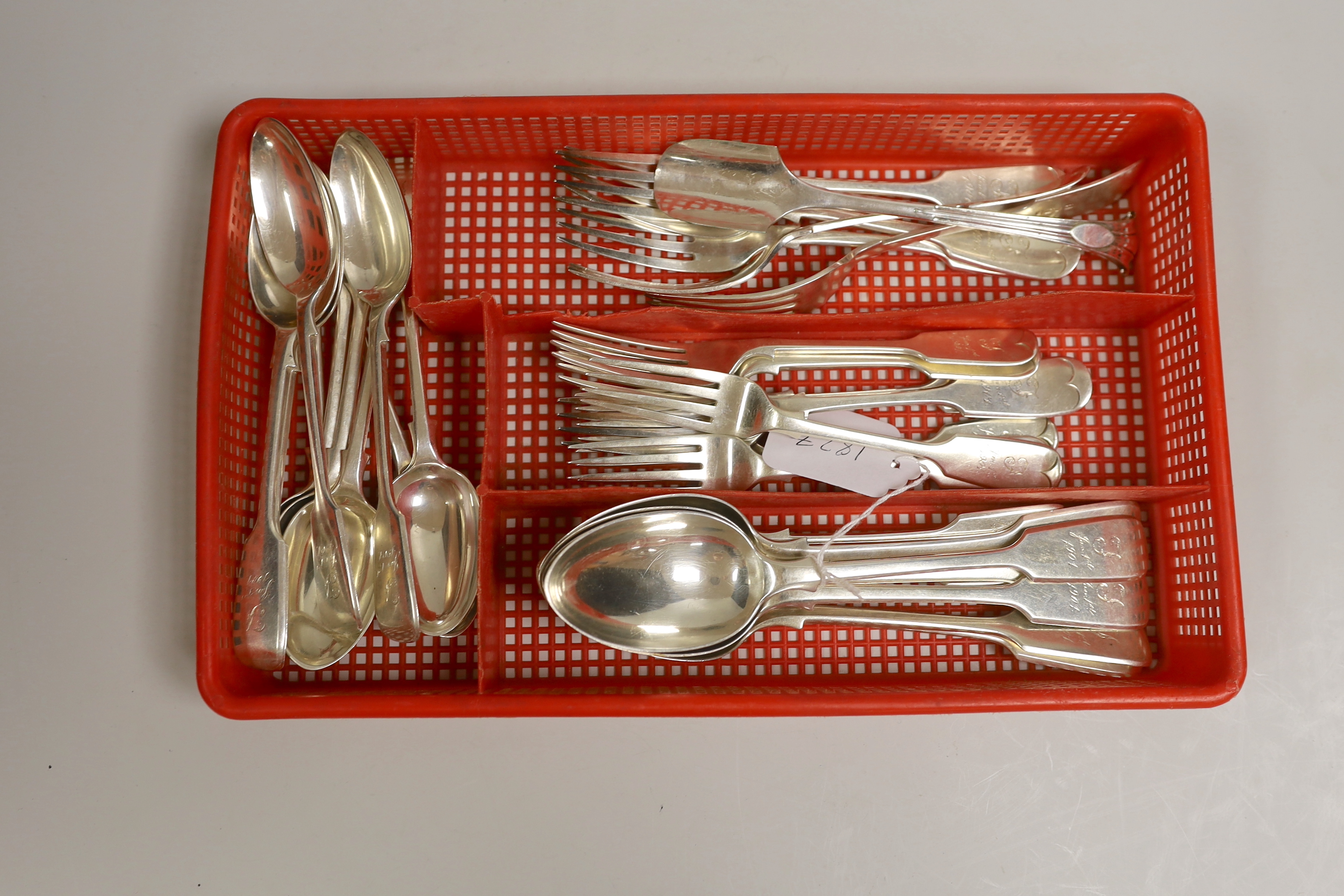 An early 20th century matched part canteen of fiddle pattern silver flatware, comprising thirty items, mainly Robert Stebbings, London 1900, 57.2oz and a plated spoon.